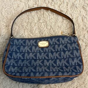 Michael Kors vintage denim crossbody bag with signature print.